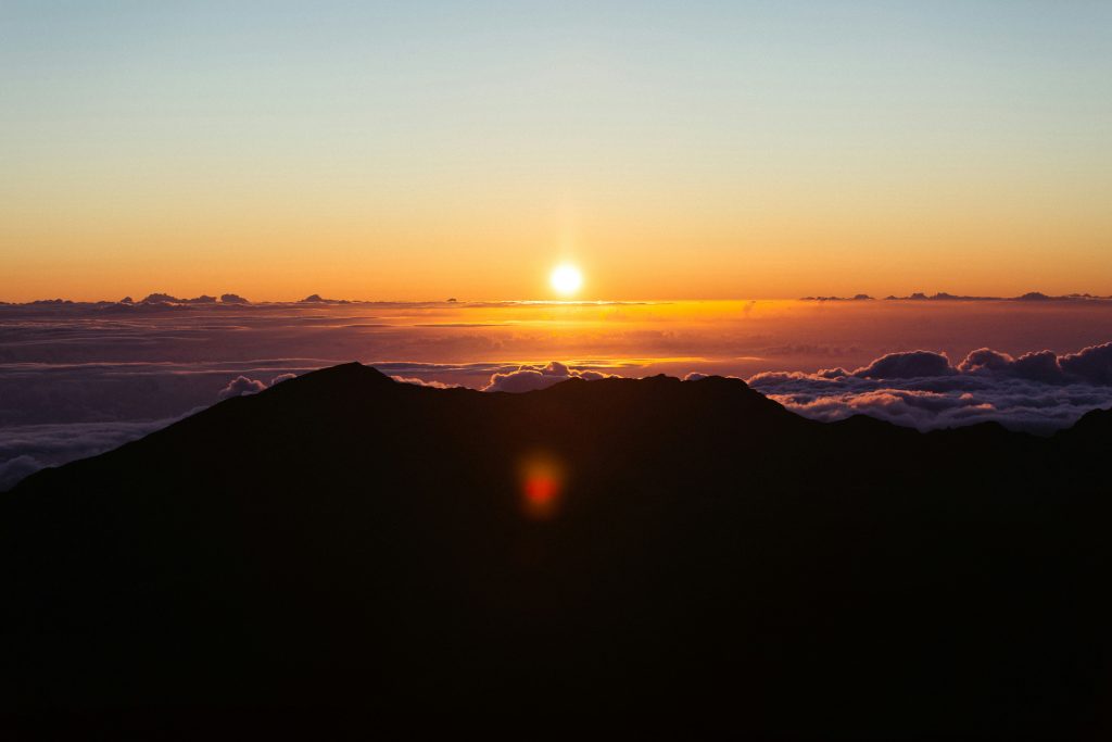Sunrise above the clouds at Haleakalā summit crater, Maui Hawaii 2026