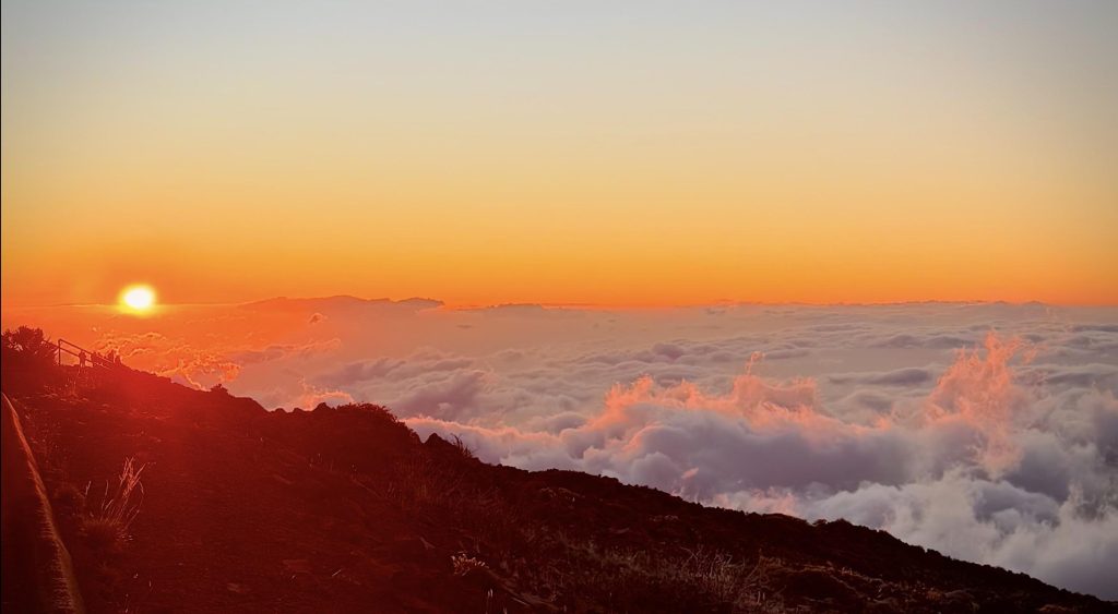 Haleakalā sunset from summit — no reservation required, warm evening colors over Maui crater 2026